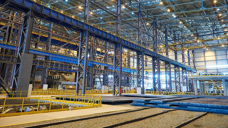 inside of warehouse showing coated beams and other architecural elements