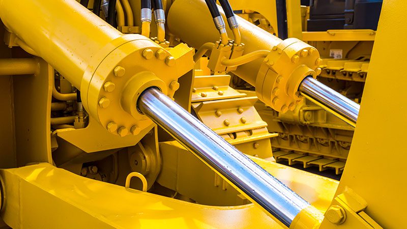 yellow powder coated part of hydraulic system