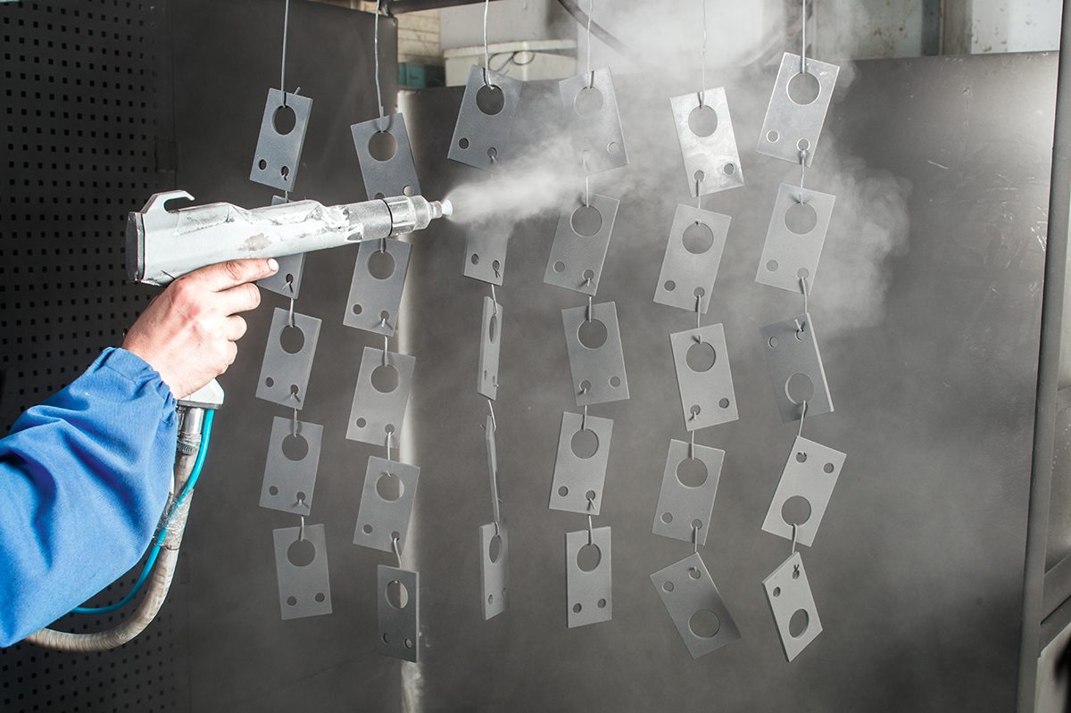 Medical grade powder coating being applied to metal parts