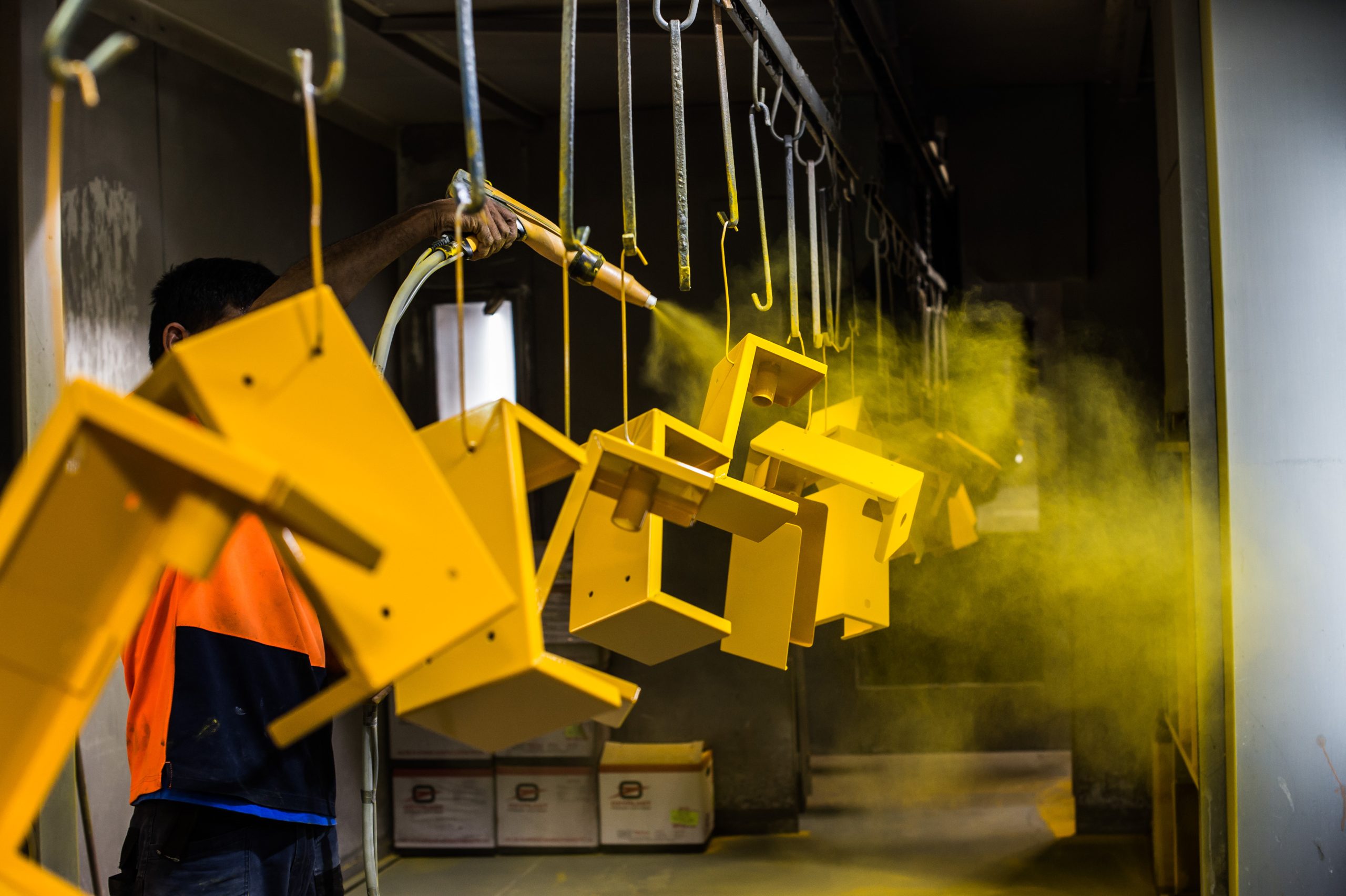 Metal parts being power-coated.